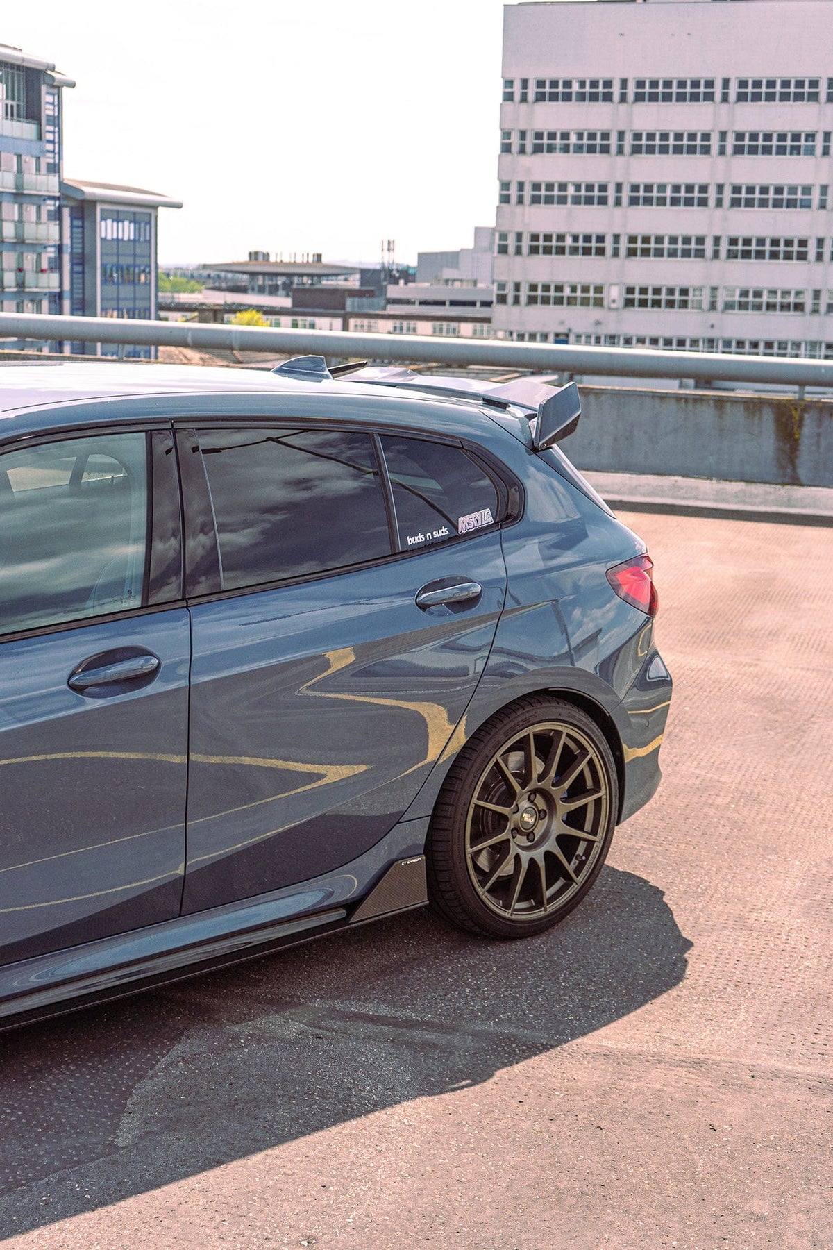 BMW 1 Series F40 and F70 carbon fibre spoiler by CT Design, featuring a sleek, aerodynamic wing for enhanced sporty appearance.