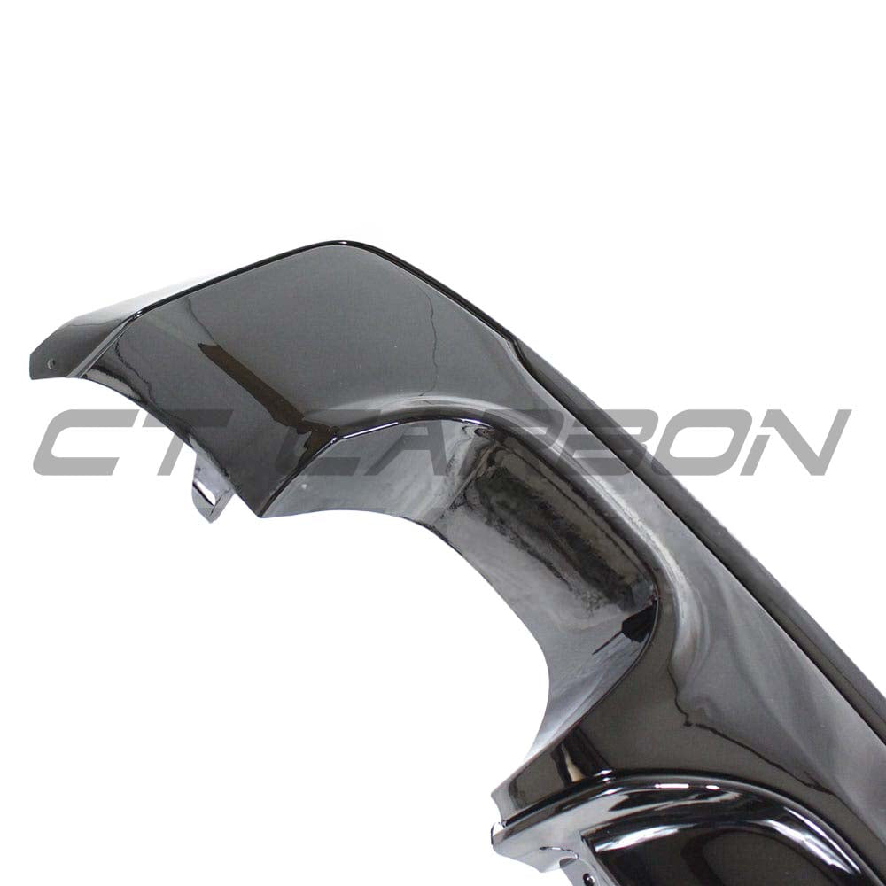 BMW 2 Series F22 F23 gloss black twin exhaust diffuser by CT Carbon, mounted on the rear of the vehicle.