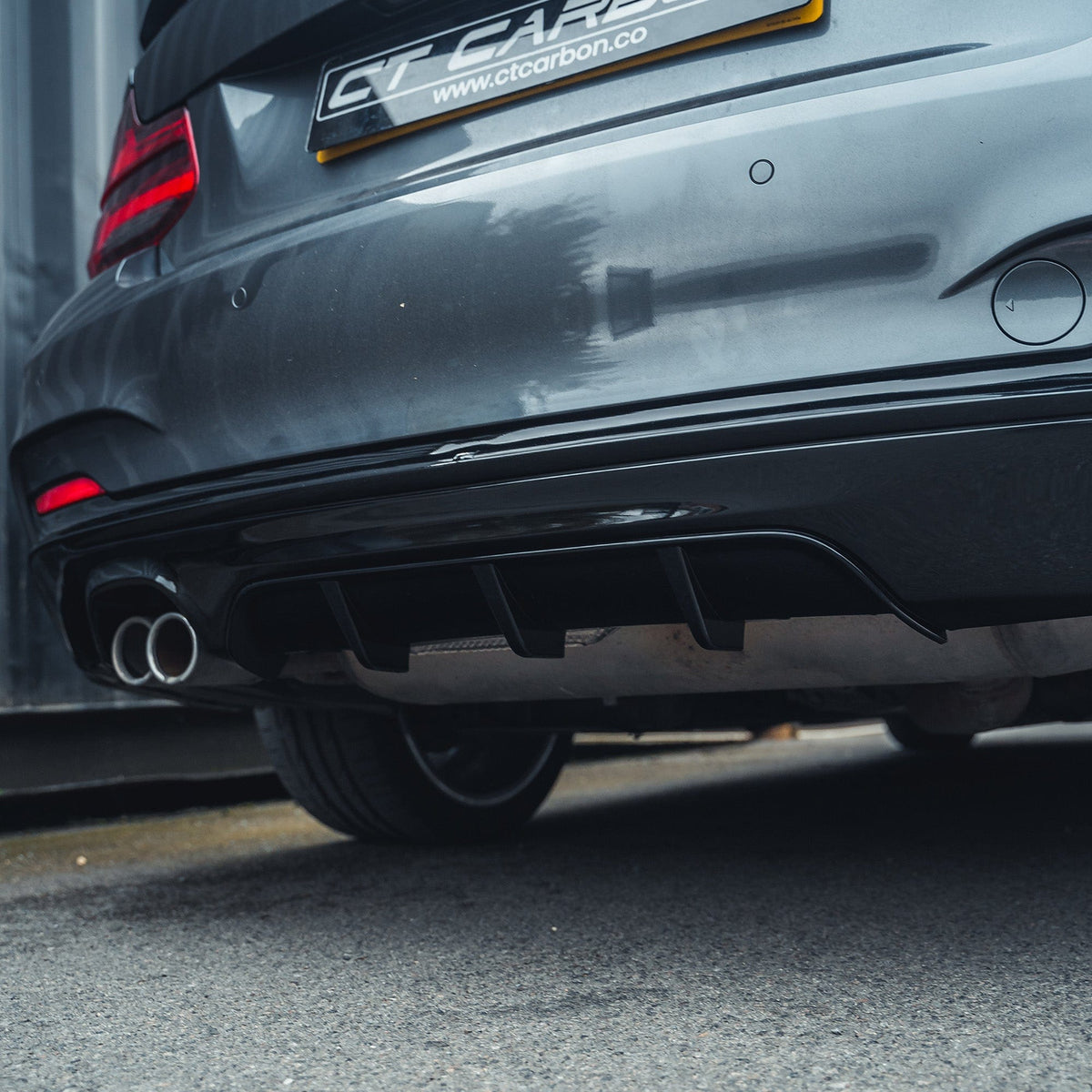 BMW 2 Series F22 F23 gloss black twin exhaust diffuser by CT Carbon, showcasing sleek design and high-quality carbon material.