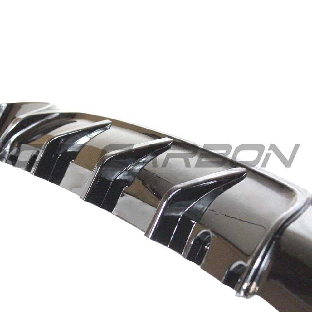 BMW 2 Series F22 F23 CT Carbon gloss black twin exhaust diffuser with sleek design, mounted on the rear of the vehicle.