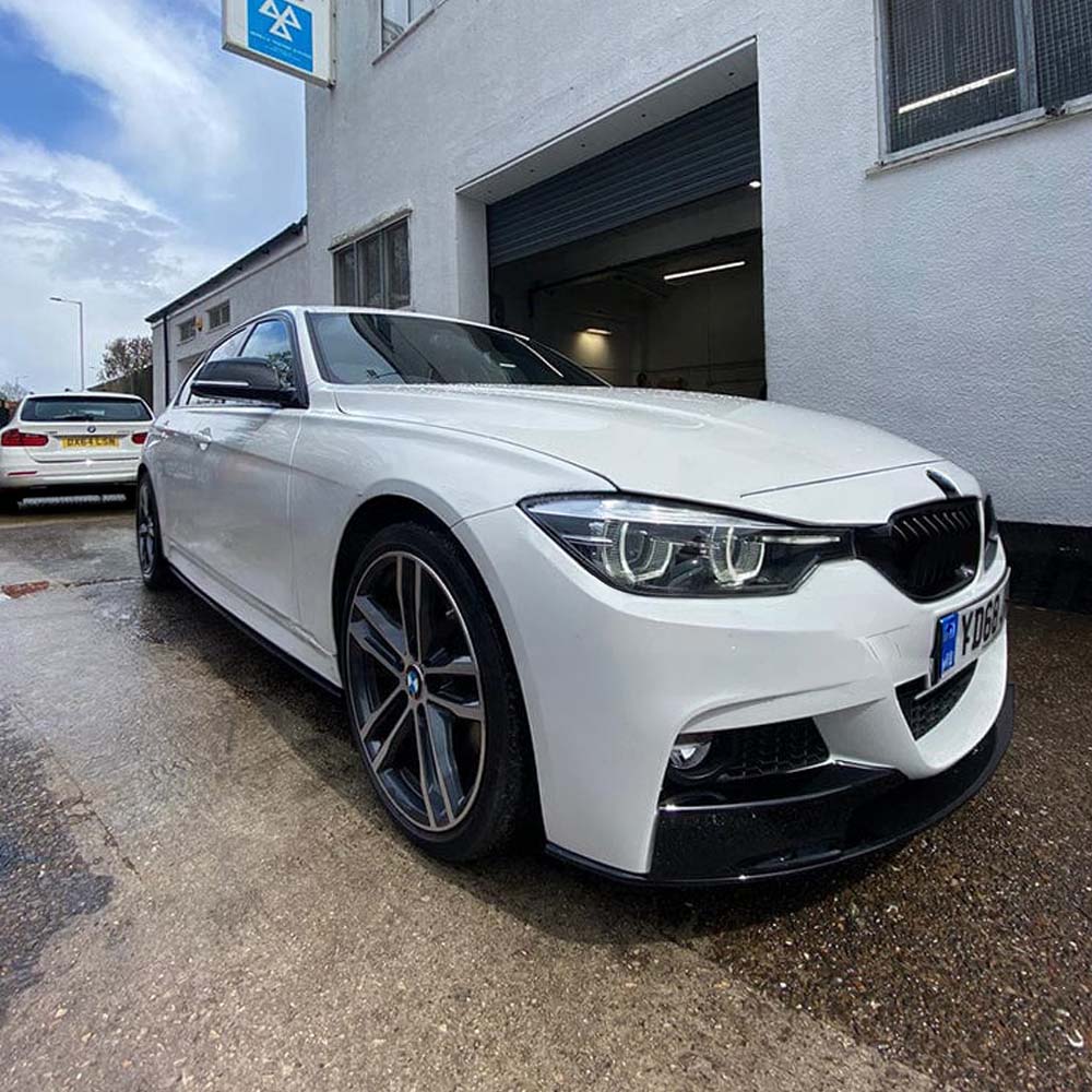 BMW 3 Series F30 F31 GLOSS BLACK side skirts by CT Carbon, V2 style, installed on vehicle, showcasing sleek aerodynamic design.