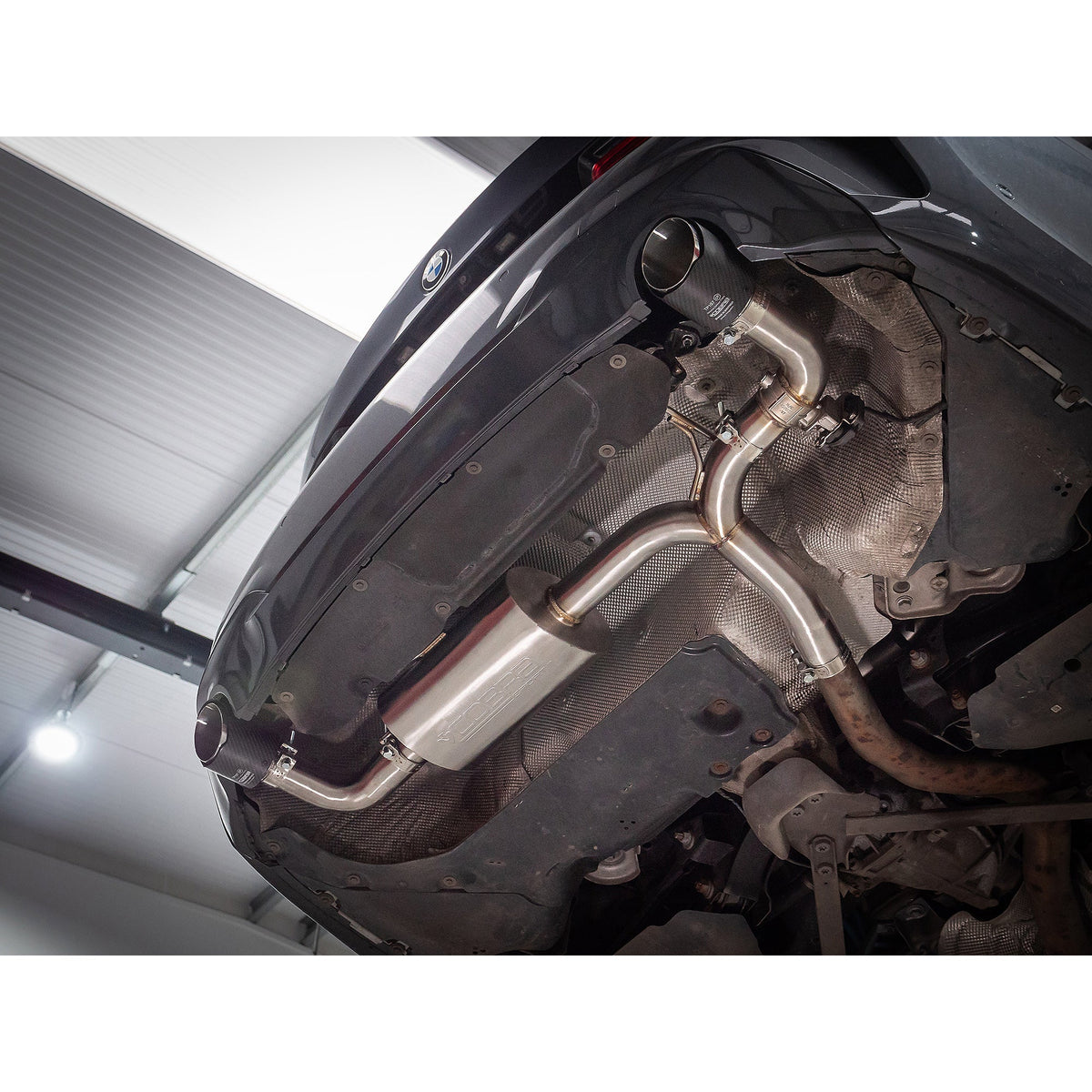 BMW 330e G20 Cobra Sport dual exit rear axle back performance exhaust with valved dual outlets on a boxed design.