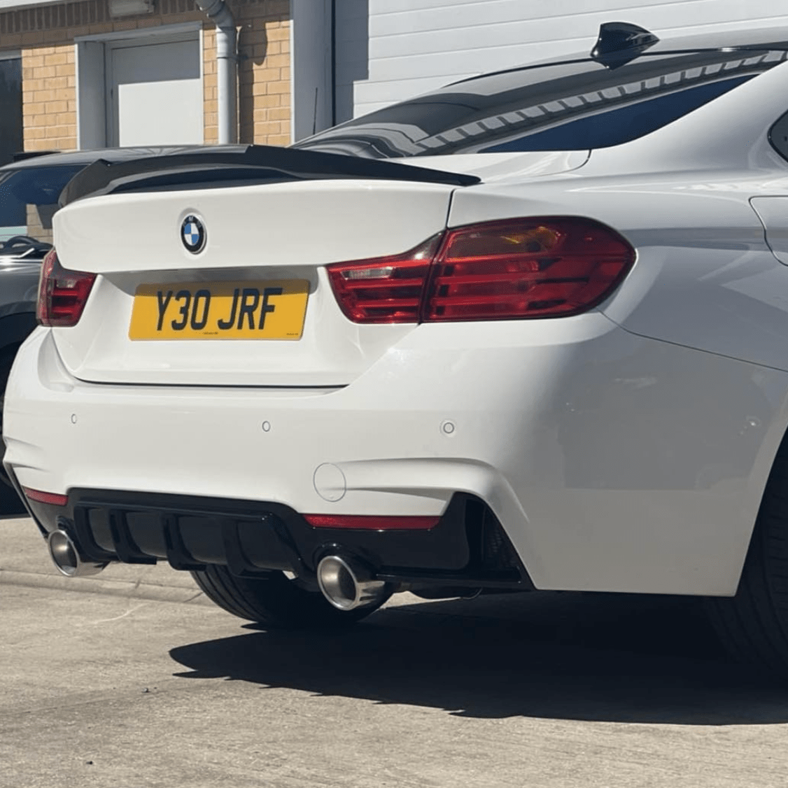 BMW 4 Series F32 CT Carbon gloss black spoiler, M-style, aerodynamic design, shown from the side view