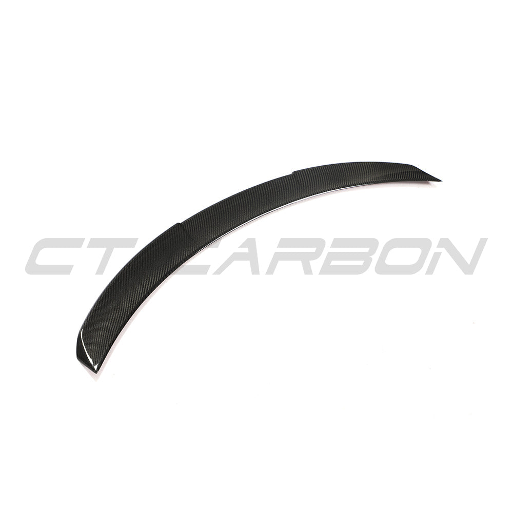 BMW 4 Series G26 and i4 carbon fiber V3 spoiler by CT Carbon, showcasing aerodynamic design and sleek carbon fiber finish.