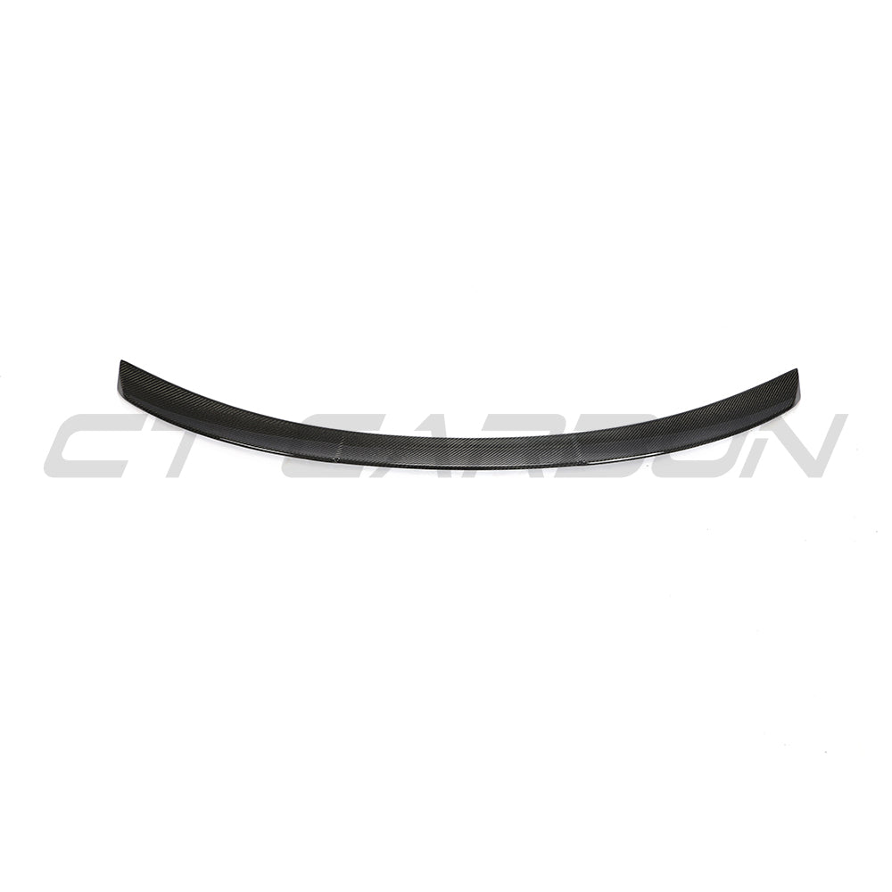 BMW 4 Series G26 and i4 carbon fiber spoiler in M4 style by CT Carbon, showcasing sleek aerodynamic design.