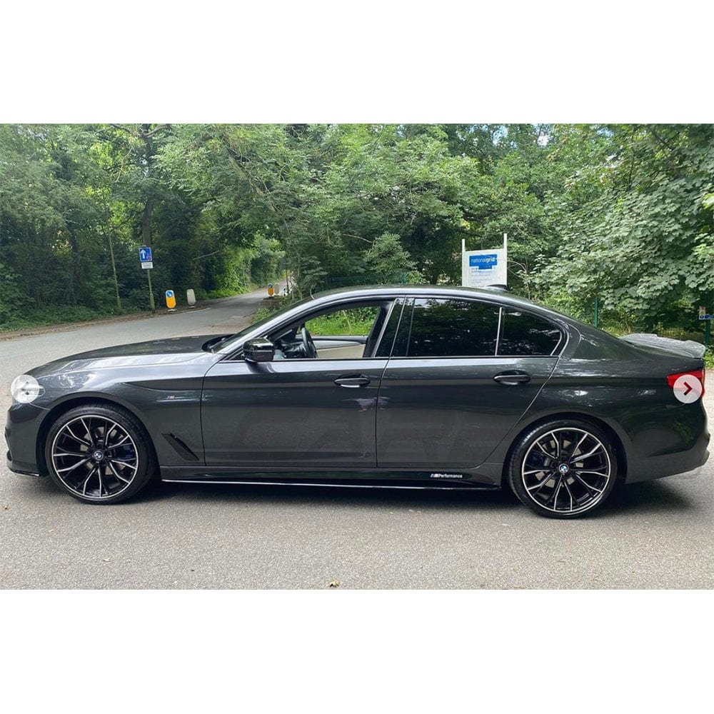 BMW 5 Series G30 gloss black full kit by CT Carbon, featuring MP-style body parts for a sleek, customized look.