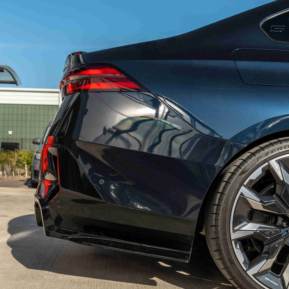 BMW 5 Series G60 and i5 2023 CT Carbon gloss black diffuser showing sleek aerodynamic design and textured surface.