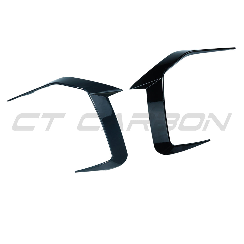 BMW 5 Series G60 and i5 2023 gloss black front bumper corners by CT Carbon, showing sleek automotive accessory details.