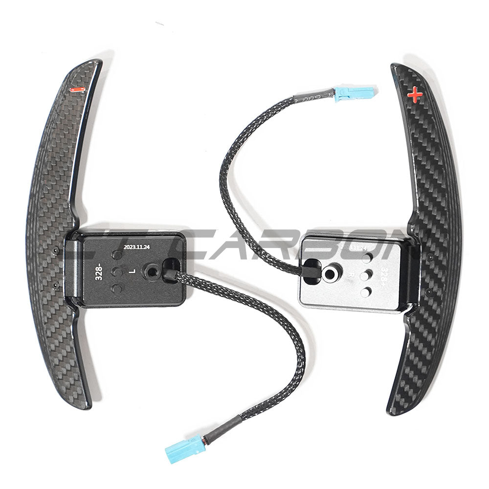 BMW carbon fiber magnetic shifter paddles from CT Carbon, showcasing sleek black carbon fiber design and magnetic attachment.