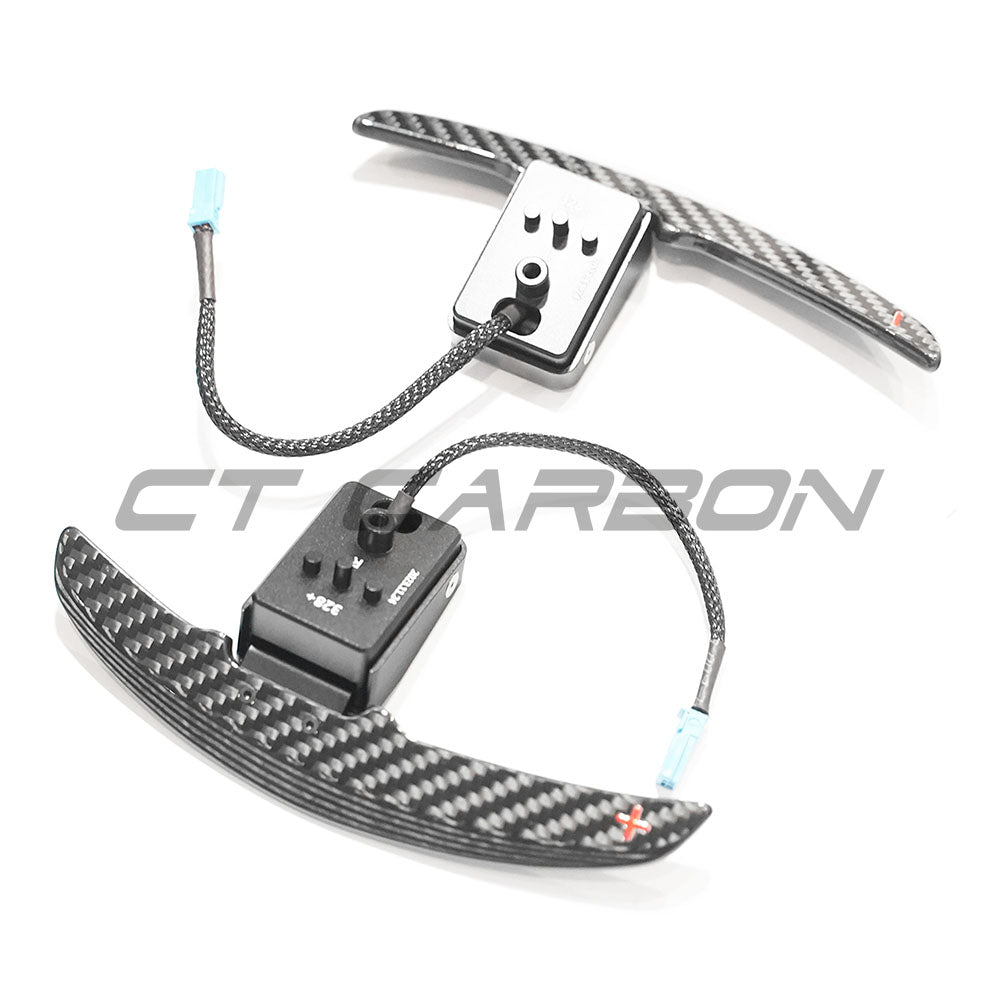BMW Carbon Fiber Magnetic Shifter Paddles by CT Carbon, sleek carbon fiber accessories for sporty steering control.