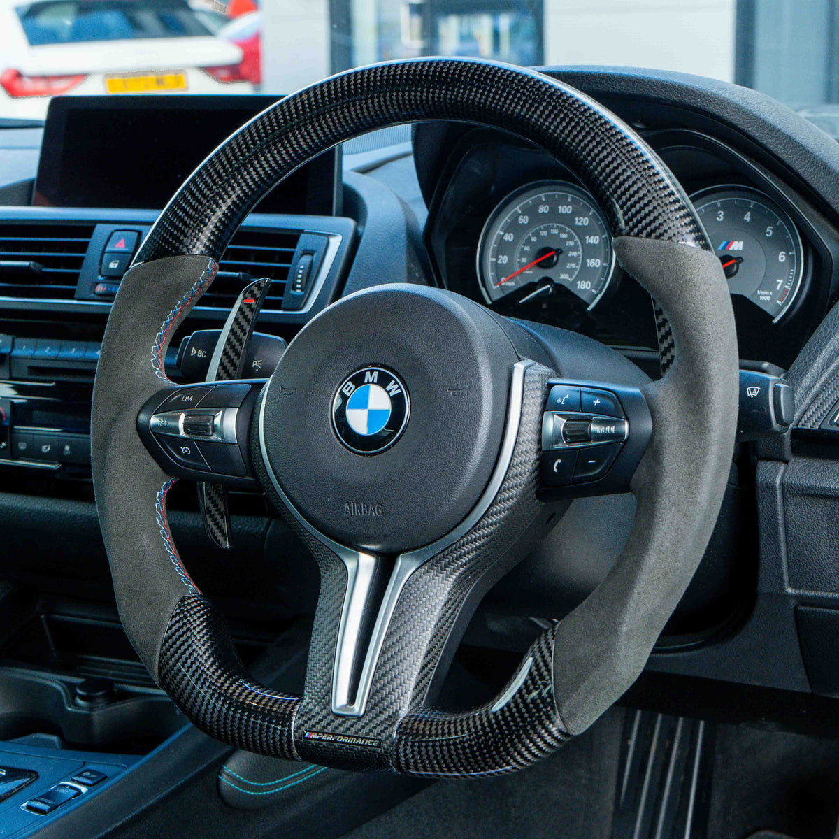 BMW carbon fiber magnetic shifter paddles by CT Carbon, featuring sleek design and lightweight carbon fiber finish.