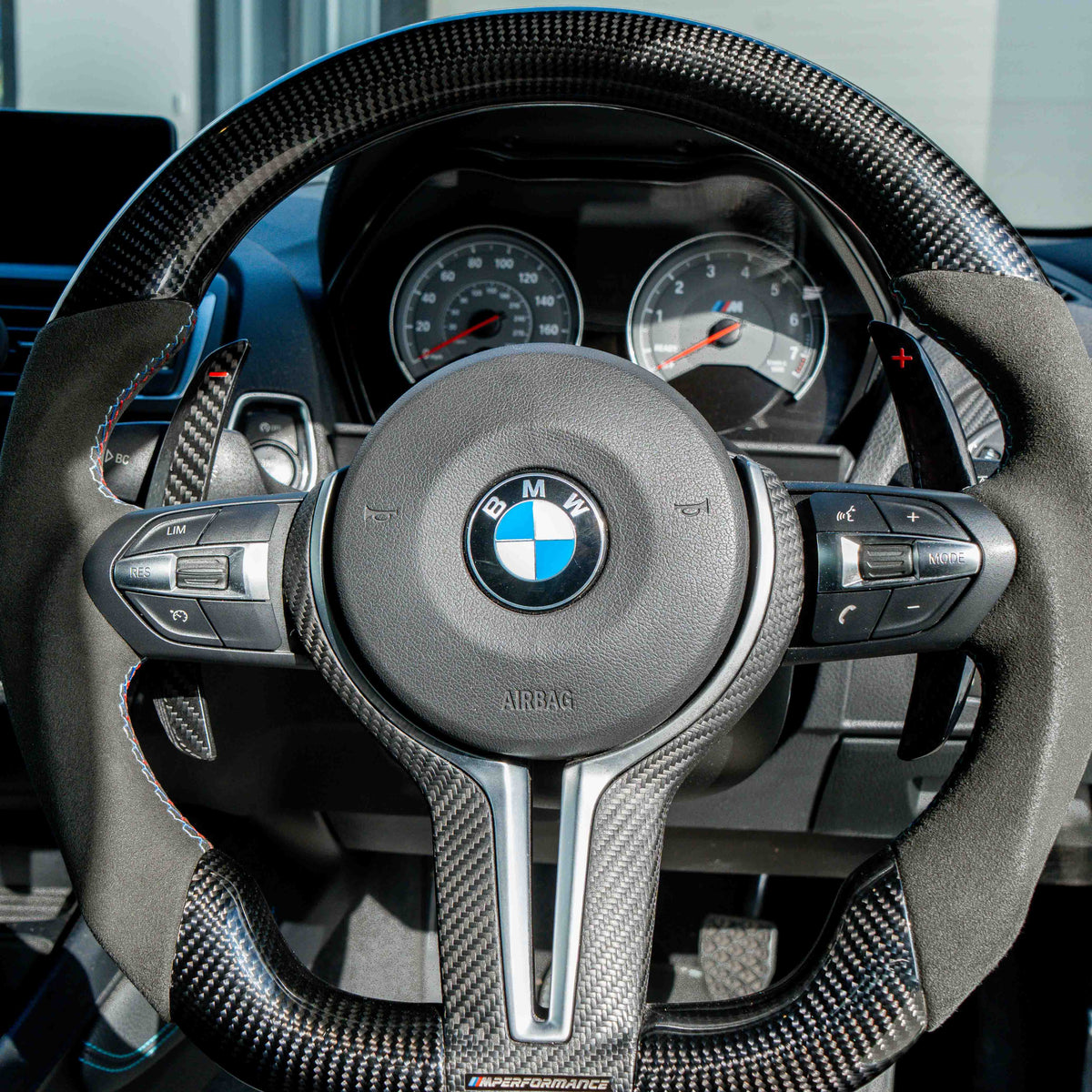 BMW carbon fiber magnetic shifter paddles by CT Carbon, sleek and lightweight car accessories for sporty steering control.