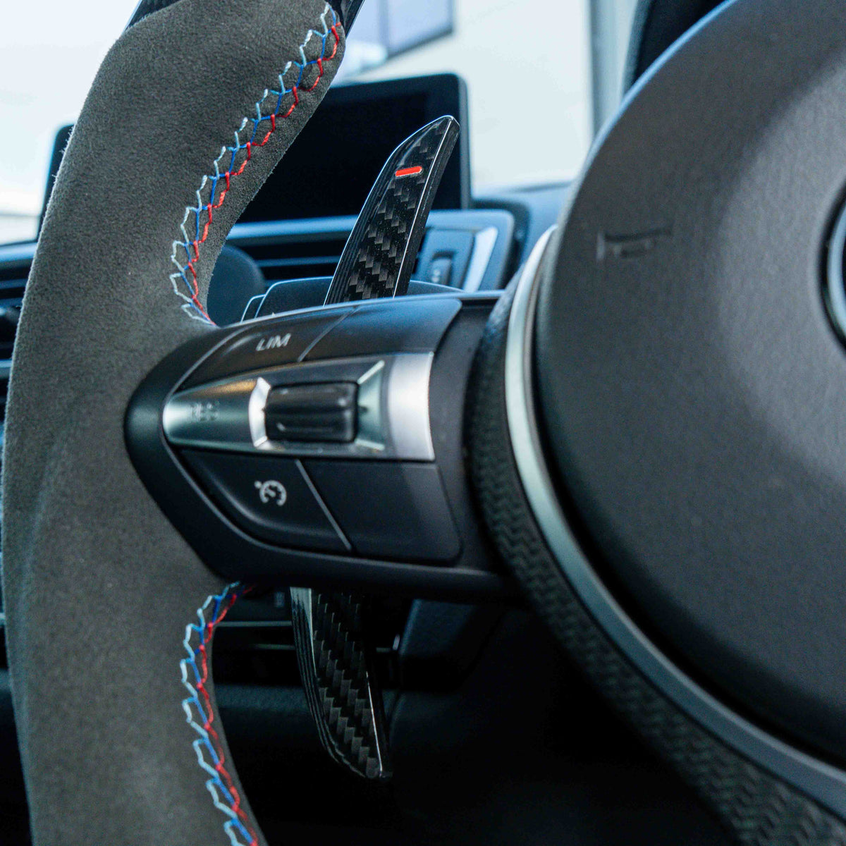 BMW carbon fiber magnetic shifter paddles by CT Carbon, sleek racing-style accessories for enhanced driving control.