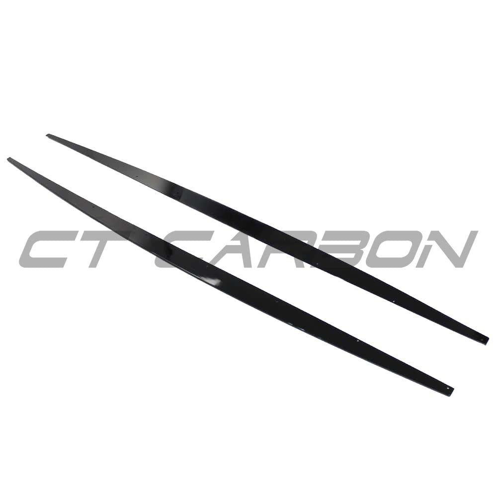 BMW F20/F21 1 Series LCI gloss black side skirts by CT Carbon, showing sleek, aerodynamic design on a white car.