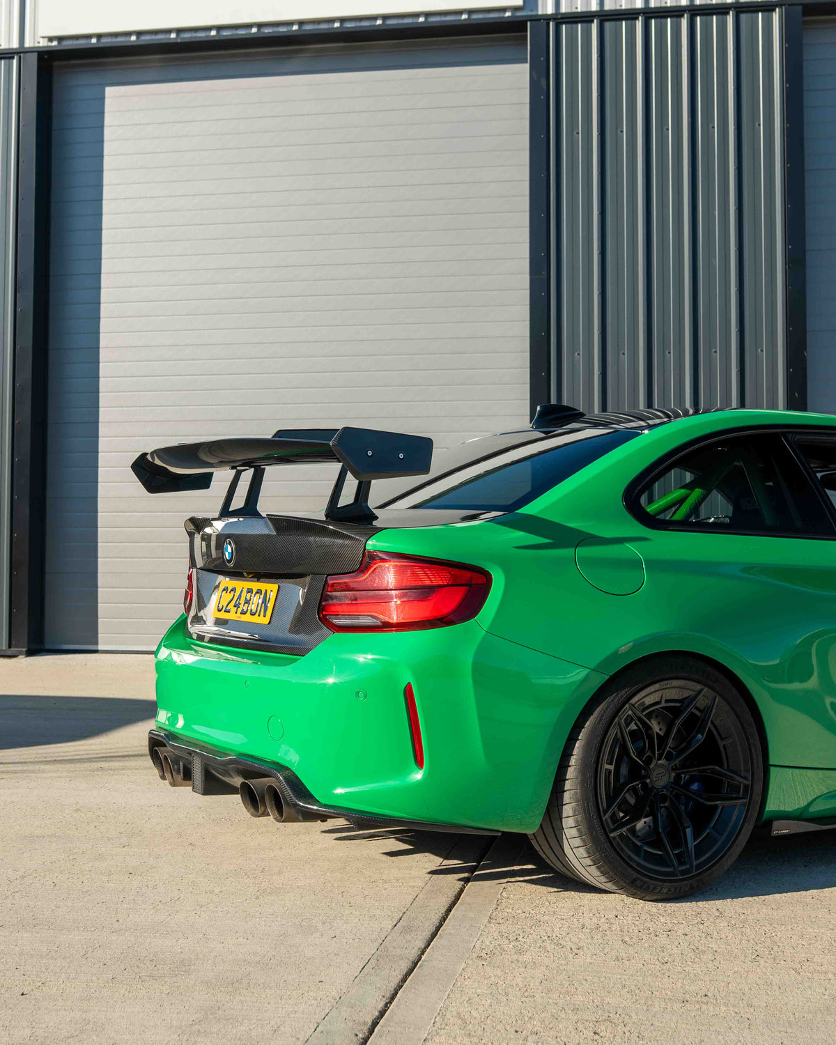 BMW F87 M2 and F22 2 Series carbon fiber swan neck spoiler by CT Carbon, showcasing sleek V8 aerodynamic wing design.
