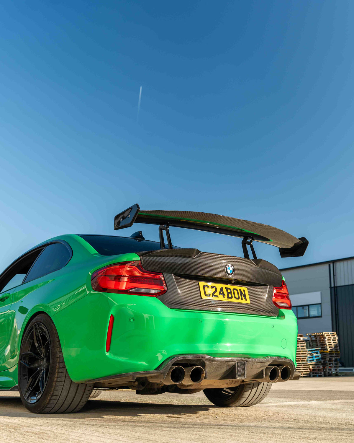 BMW F87 M2 and F22 2 Series carbon fiber swan neck wing spoiler by CT Carbon, showcasing aerodynamic design and sleek finish.