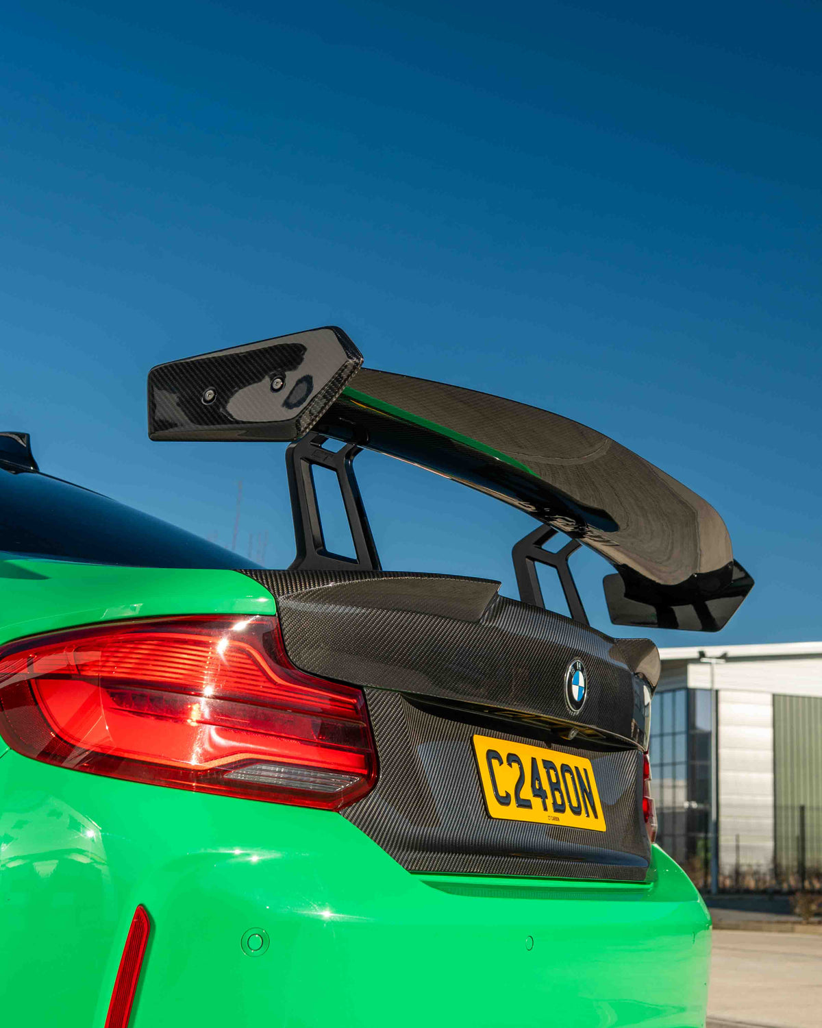 BMW F87 M2, M2C, F22 2 Series carbon fibre swan neck wing spoiler by CT Carbon, featuring V8 design and aerodynamic details.