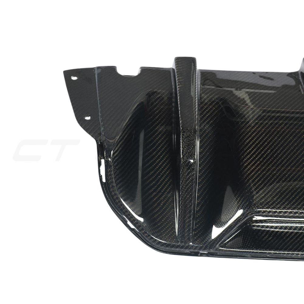 BMW F90 M5 saloon with CT Carbon full carbon fiber kit, including front splitter, side skirts, and rear diffuser.