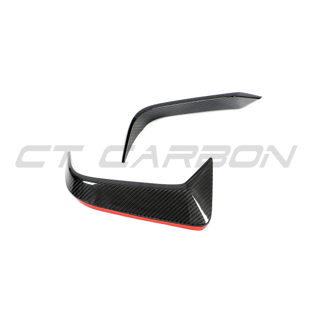 BMW F95 X5M 2019-2022 pre-LCI carbon fiber rear bumper trim by CT Design, close-up of sleek black carbon fiber accessory.