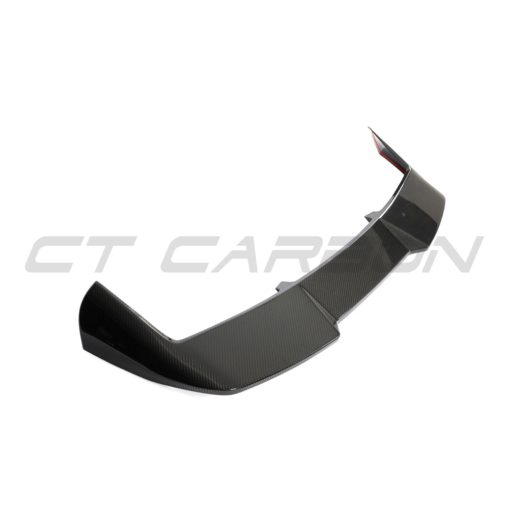 BMW F95 X5M 2019-2024 carbon fiber roof spoiler by CT Carbon, shown installed on the vehicle's roof for enhanced aerodynamics.