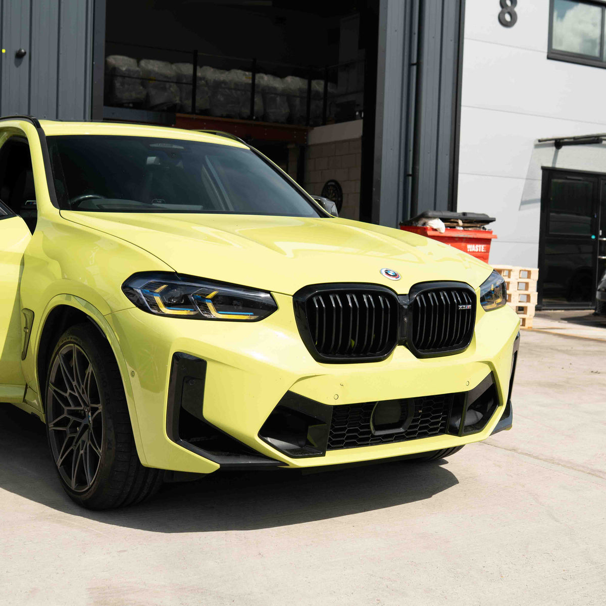 BMW F97 X3M LCI yellow adaptive DRL module set by CT Carbon, showing the sleek yellow daytime running lights for 2022+ models.