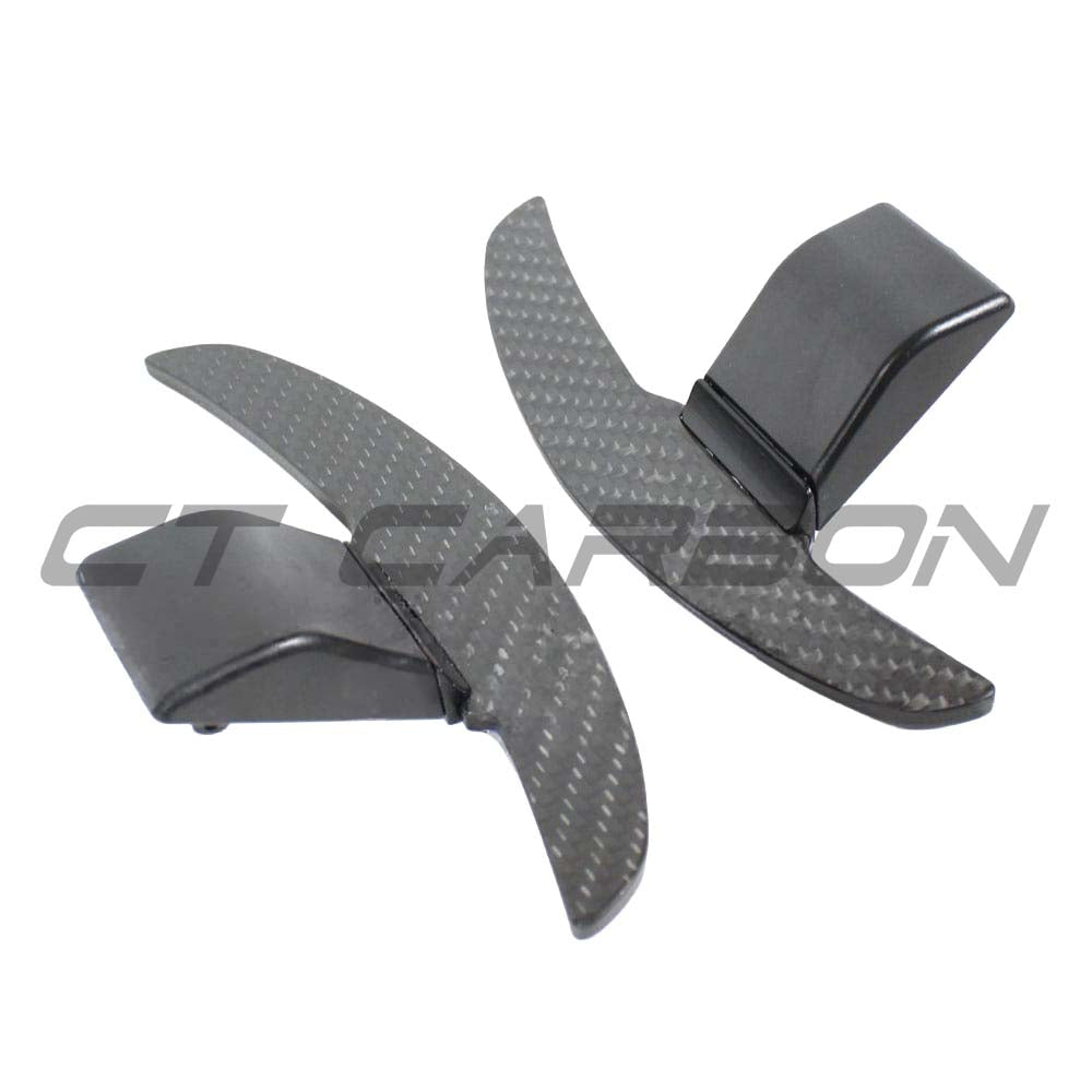 BMW Fxx carbon fiber shifter paddles by CT Carbon, close-up view showing sleek, lightweight racing-style car accessories.