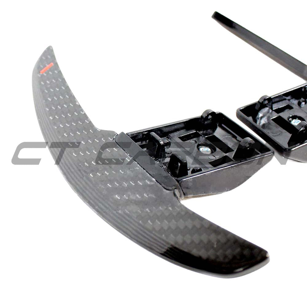 BMW Fxx carbon fiber shifter paddles by CT Carbon, showing sleek black lightweight racing-style gear shift paddles.