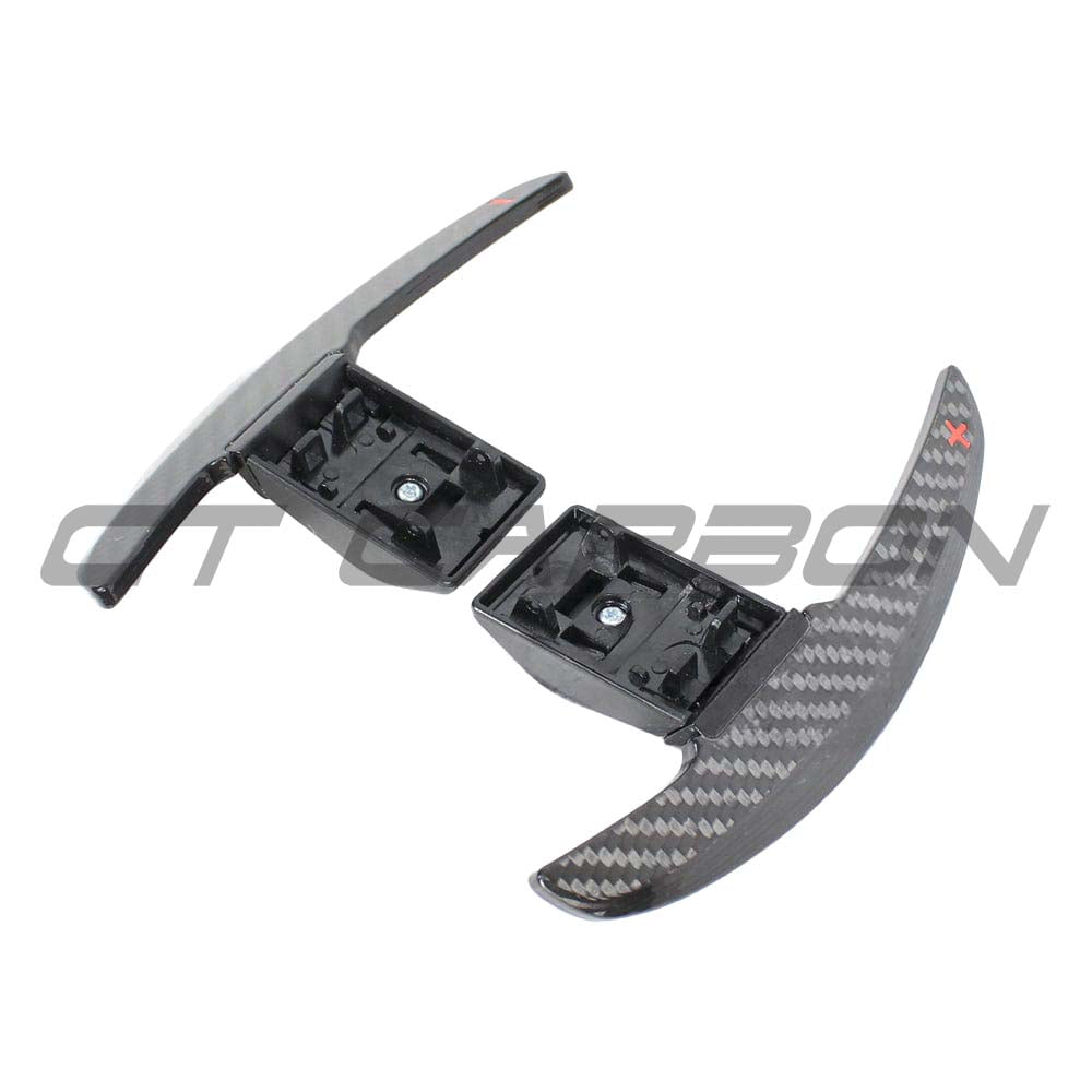 BMW Fxx carbon fiber shifter paddles by CT Carbon, close-up of sleek, lightweight paddles with textured carbon fiber finish.