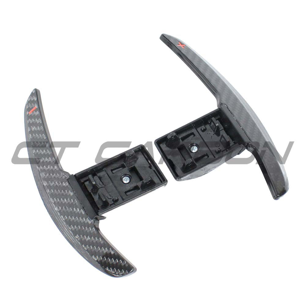 BMW Fxx carbon fibre shifter paddles from CT Carbon, sleek racing-style accessories for enhanced driving control.