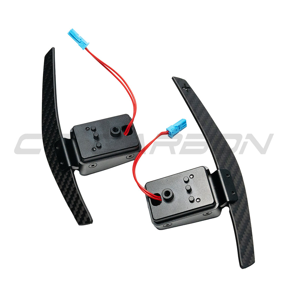 BMW Fxx matte carbon fiber magnetic shifter paddles by CT Carbon, showcasing sleek, lightweight racing-style paddle design.