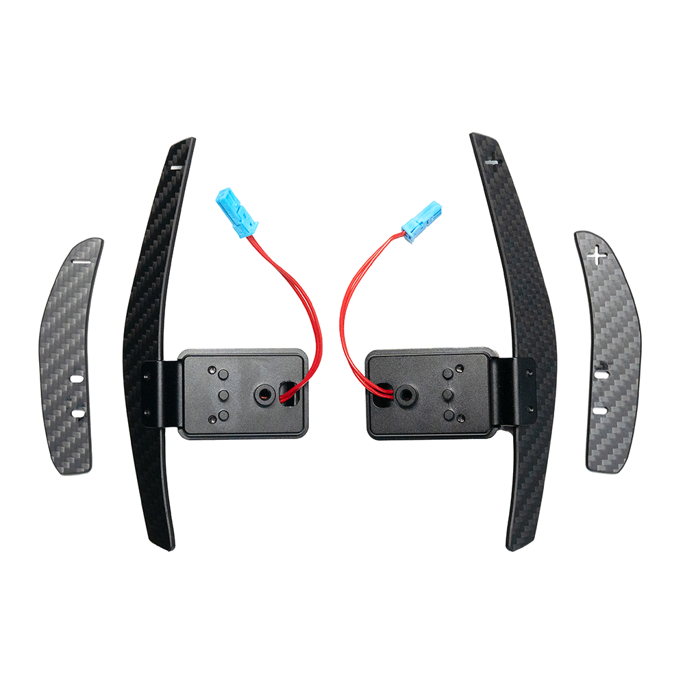BMW Fxx matte carbon fiber magnetic shifter paddles by CT Carbon, showing sleek carbon fiber surface and magnetic attachment points.