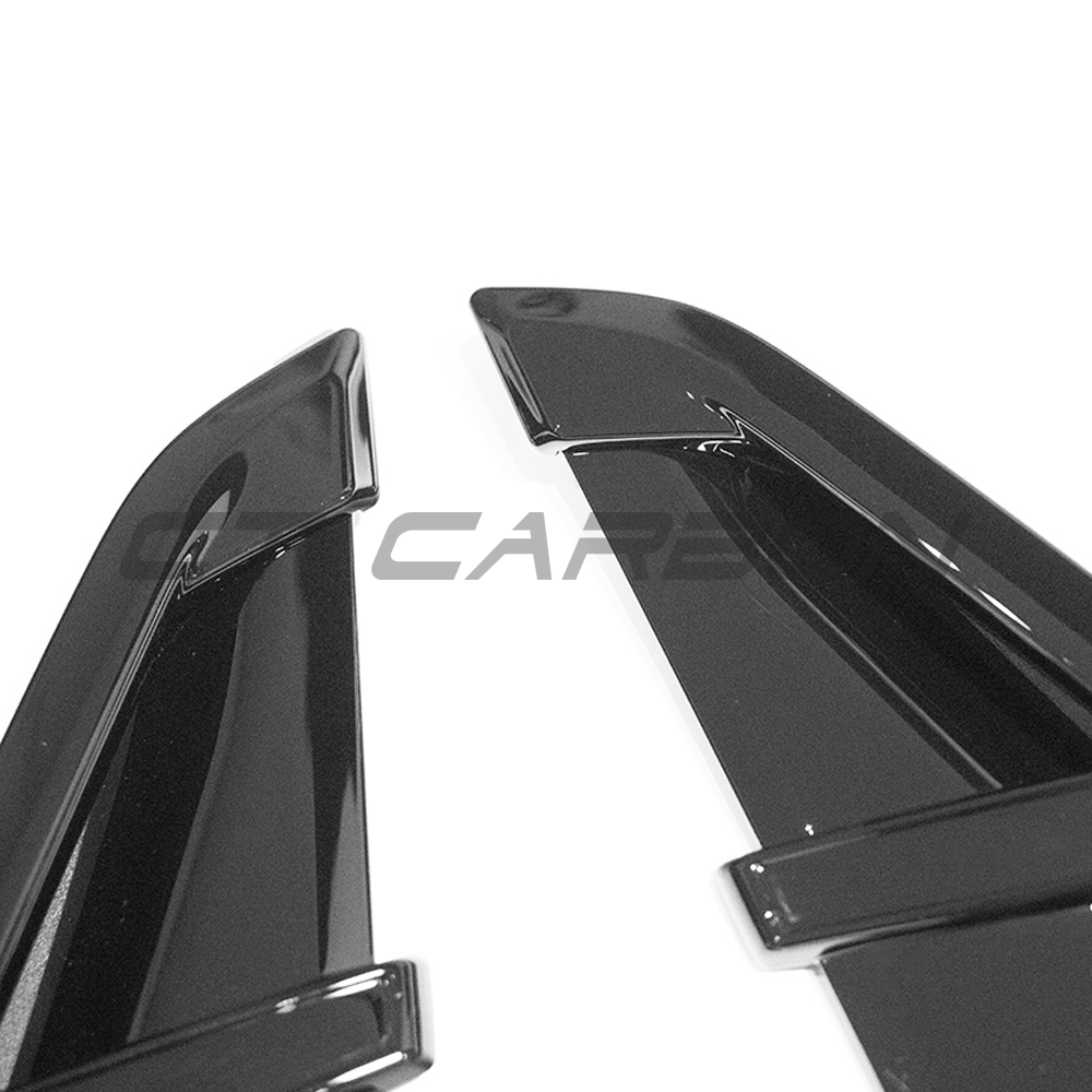 BMW G01 X3 gloss black fender trims by CT Carbon, close-up of sleek, shiny accessory enhancing vehicle's exterior.