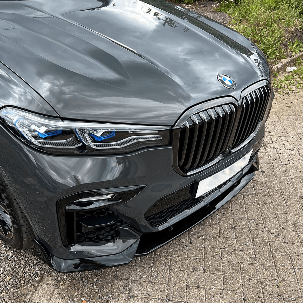 BMW G07 X7 2018-2022 CT Carbon full gloss black kit shown on vehicle, featuring sleek black accents for a stylish upgrade.