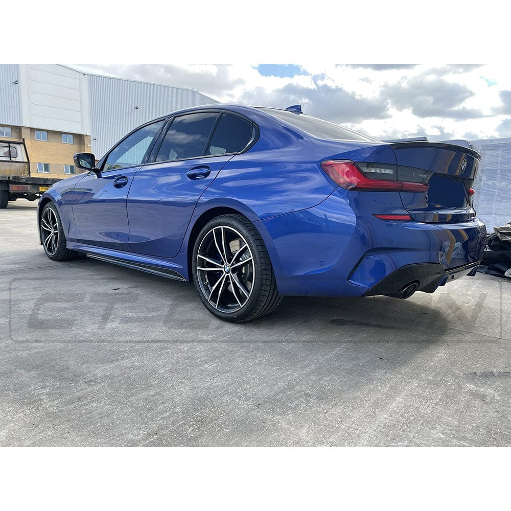 BMW G20 3 Series pre-LCI 2018-2022 gloss black exhaust kit with round tips by CT Carbon, shown on the vehicle.