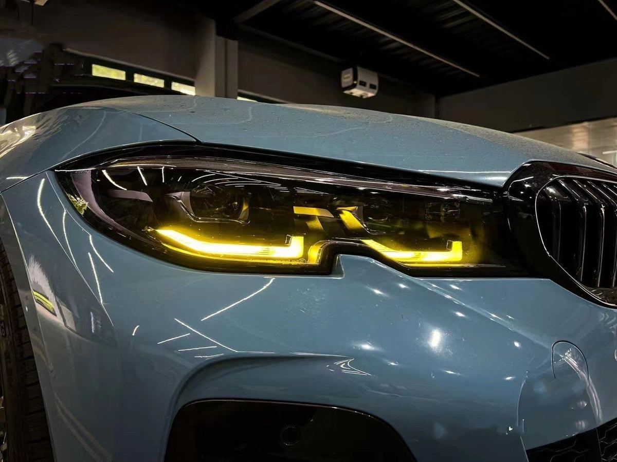 BMW G20 G21 3 Series yellow adaptive LED DRL module set by CT Carbon, showing installed daytime running lights on the vehicle.
