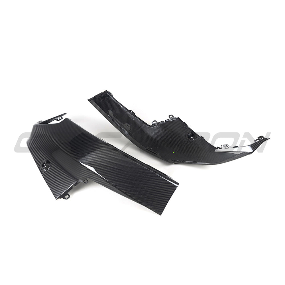 BMW G42 2 Series carbon fiber rear bumper corners by CT Carbon, close-up of sleek, lightweight car accessory with textured finish.