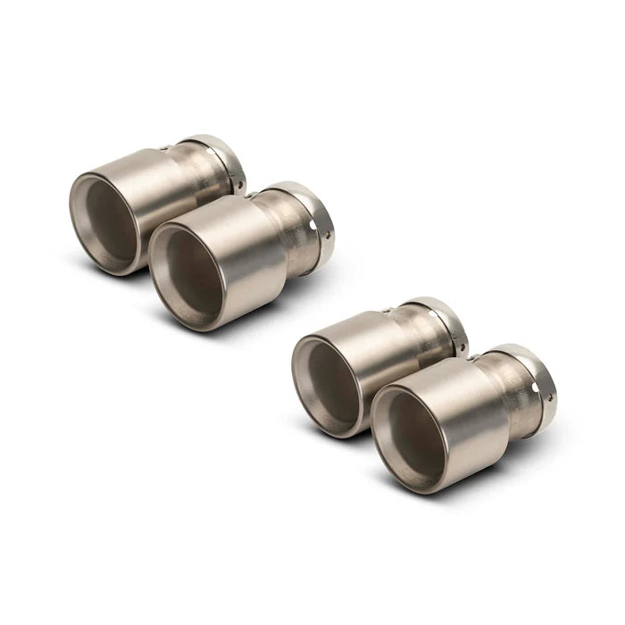 Remus BMW G80 M3 G82 M4 cat back exhaust system with polished tips and dual exhaust pipes, mounted on a black vehicle.