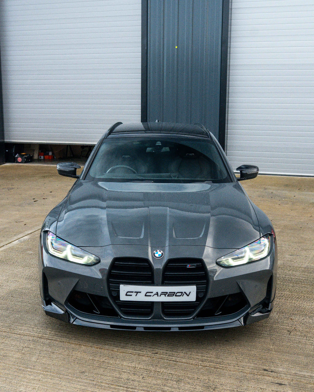 BMW G80 G81 M3 and G82 G83 M4 CT Carbon gloss black duct accessories installed on vehicle front vents.