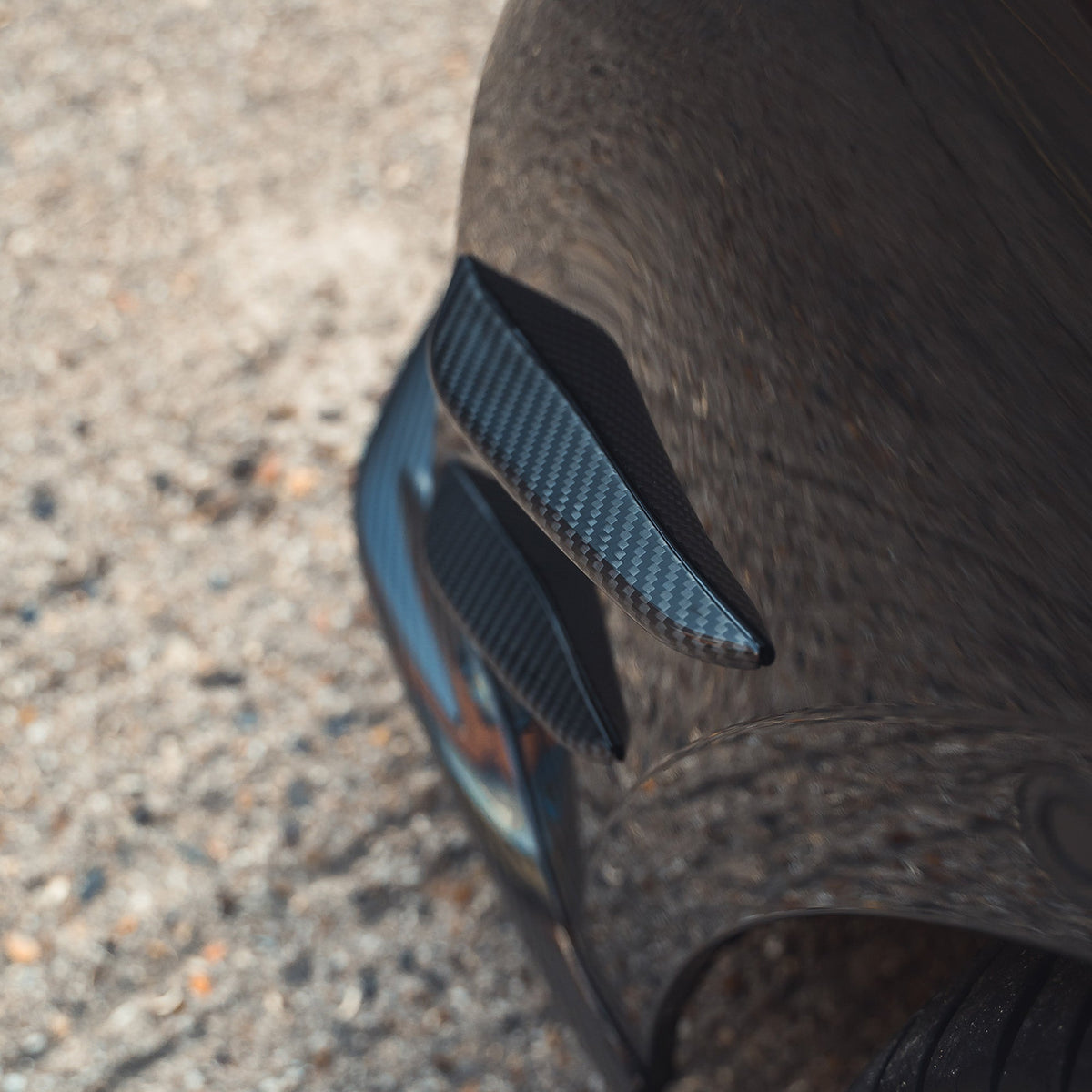 BMW G87 M2 carbon fibre front bumper canards by CT Carbon, lightweight aerodynamic accessories for sporty enhancement.