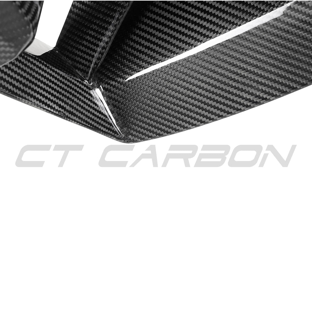 BMW G87 M2 carbon fiber front ducts by CT Carbon, showing sleek, lightweight aerodynamic accessories with detailed carbon fiber finish.