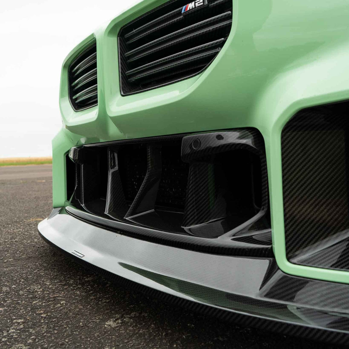 BMW G87 M2 carbon fiber lower grille accessory by CT Design, showcasing the sleek, lightweight carbon fiber finish.