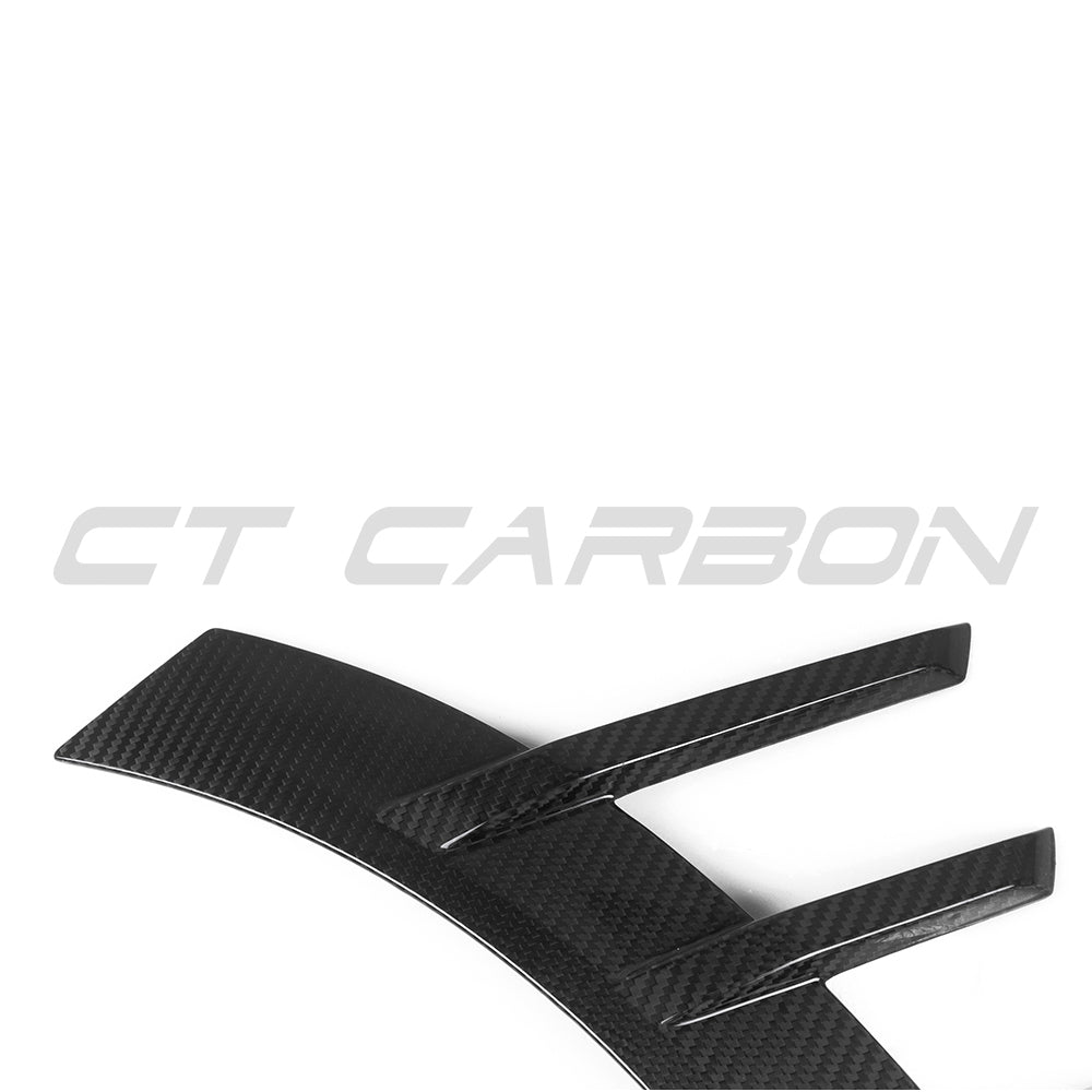 BMW G87 M2 carbon fibre rear side fender trim accessory by CT Carbon, showcasing sleek, lightweight carbon fibre details on the car.