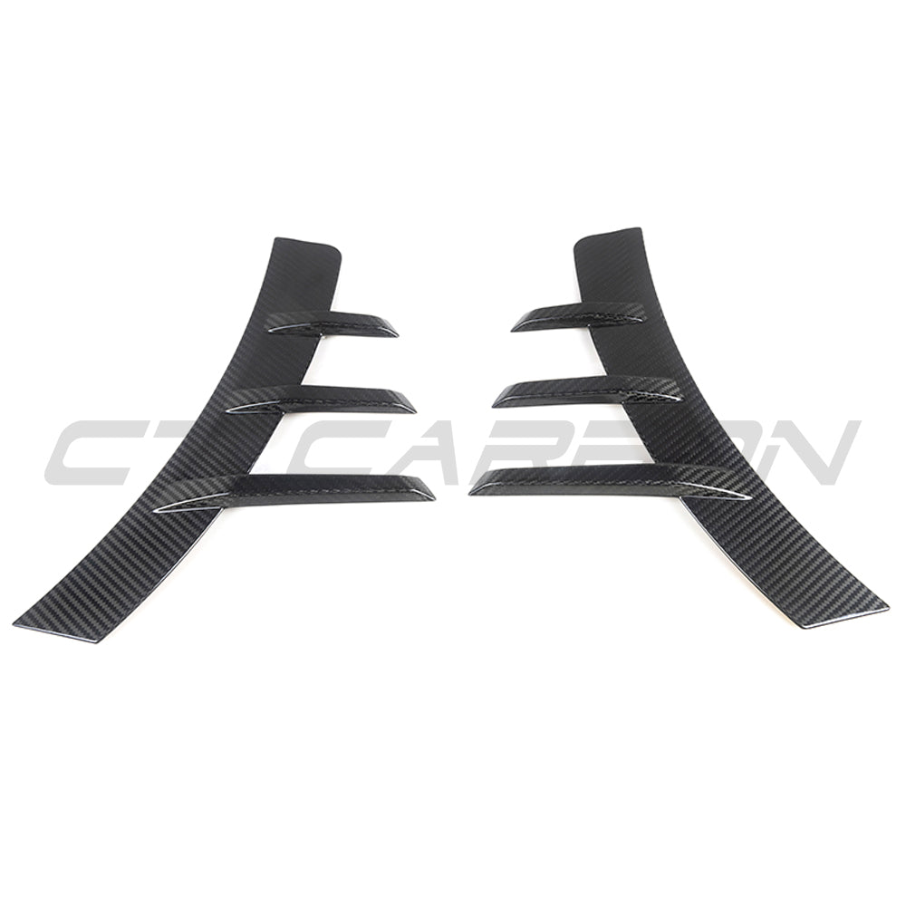 BMW G87 M2 carbon fibre rear side fender trim accessory by CT Carbon, showcasing sleek lightweight design and textured finish.