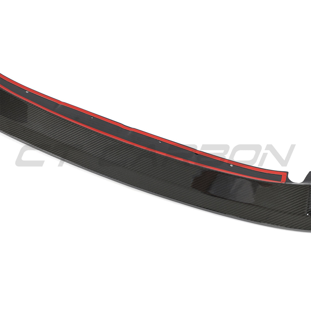 BMW G87 M2 carbon fibre front end kit by CT Design, featuring splitter and aerodynamic components, installed on the car.