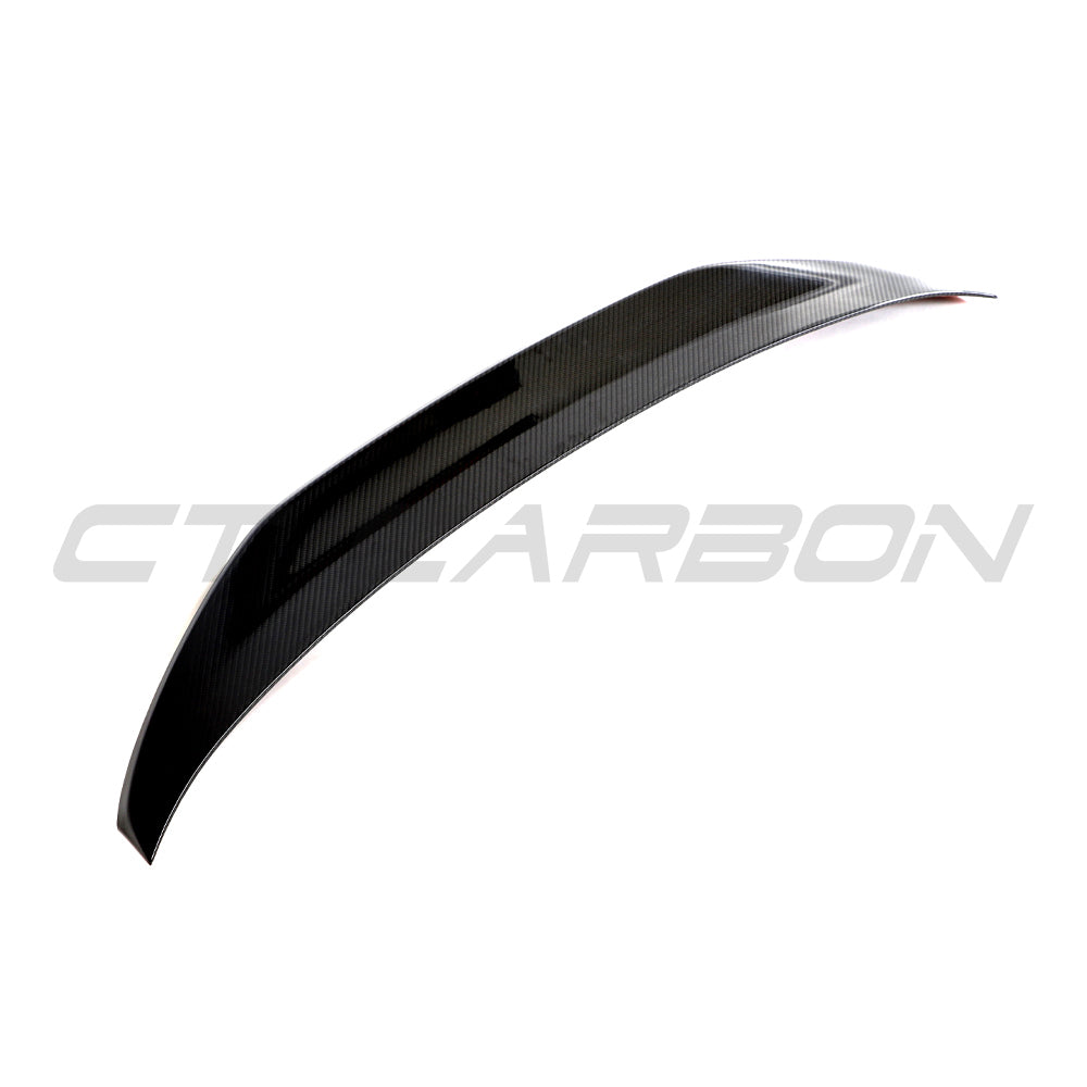 BMW G42 2 Series 2022+ full carbon fibre kit by CT Carbon, featuring a sleek carbon fibre spoiler on a sporty car.