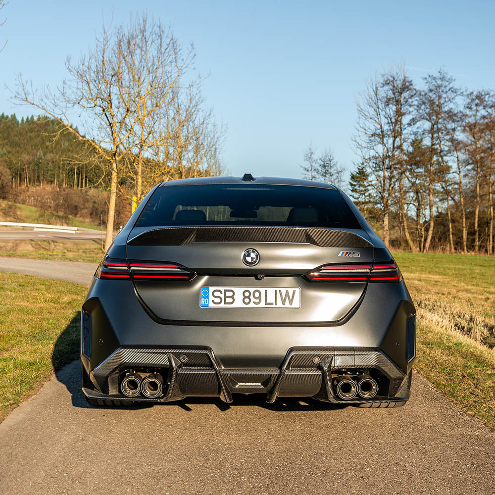 BMW G90 M5 & G99 M5 Touring 2024 carbon fiber diffuser by CT Carbon, showcasing sleek design and textured carbon fiber finish.