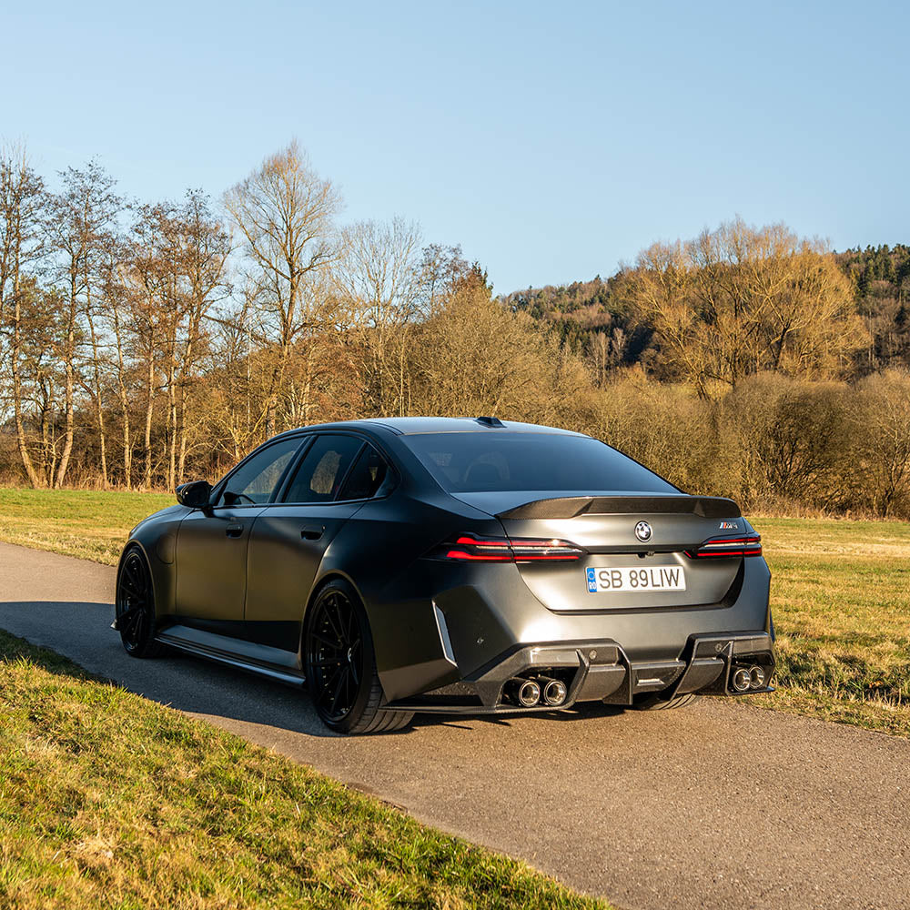 BMW G90 M5 and G99 M5 Touring 2024 carbon fibre diffuser by CT Design, showcasing sleek design and lightweight carbon fiber material.