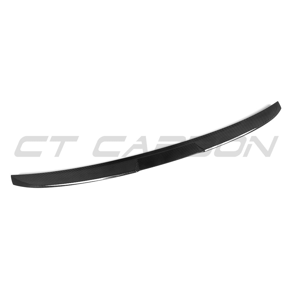BMW G60 5 Series full carbon fibre kit from CT Carbon, including spoiler and body accents on a sleek vehicle.