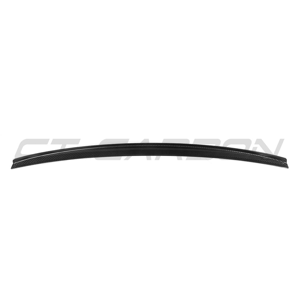 BMW G60 5 Series carbon fiber full car kit by CT Carbon, featuring a sleek roof spoiler and aerodynamic enhancements.