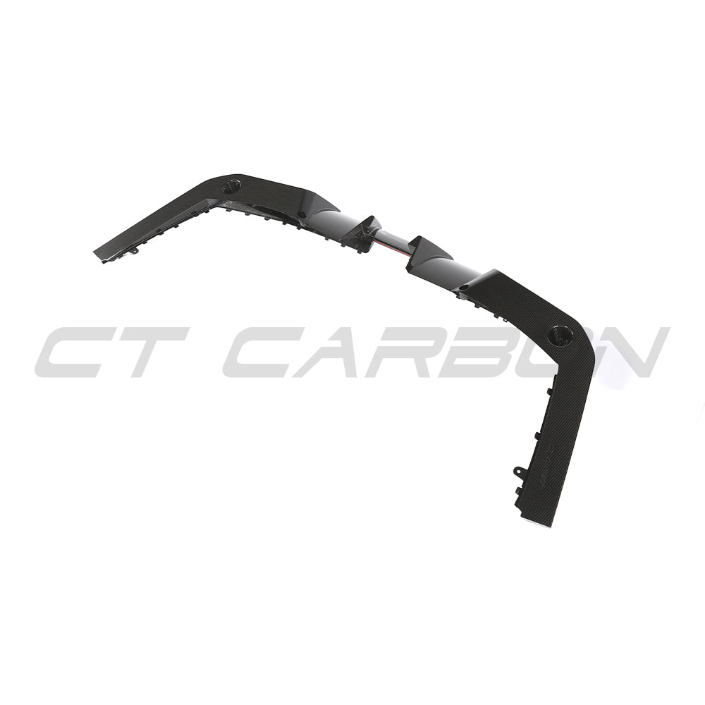 BMW G90 G99 M5 2024 carbon fiber diffuser by CT Design, showcasing sleek aerodynamic design and textured carbon fiber surface.
